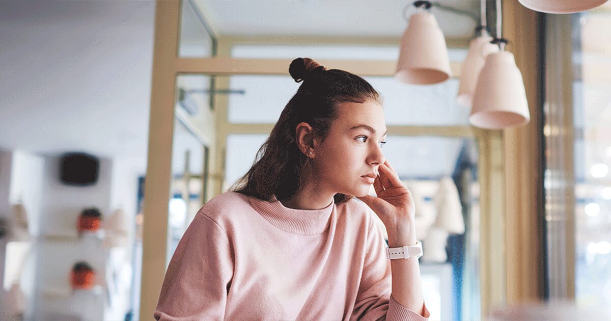Woman thoughtfully preparing to talk with her family while considering abortion.